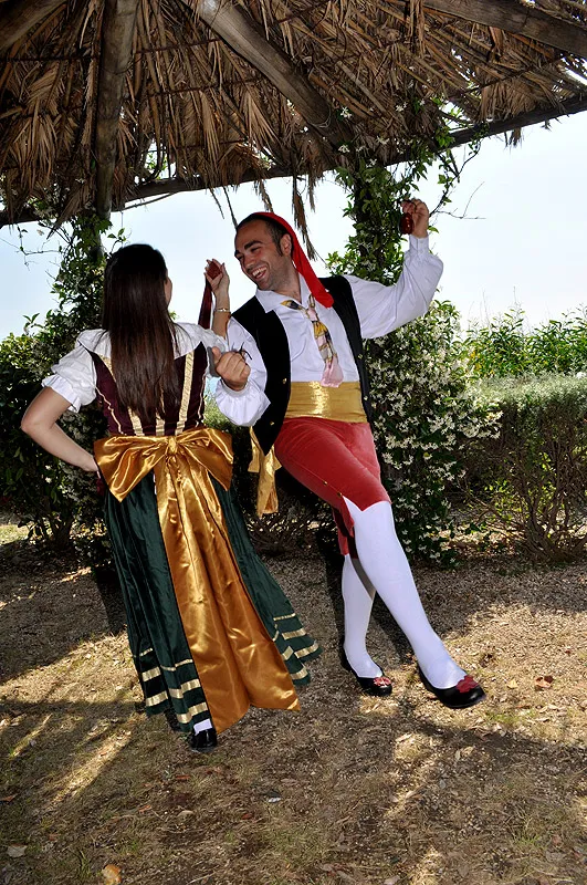 Dancers performing the little hops of the tarantella