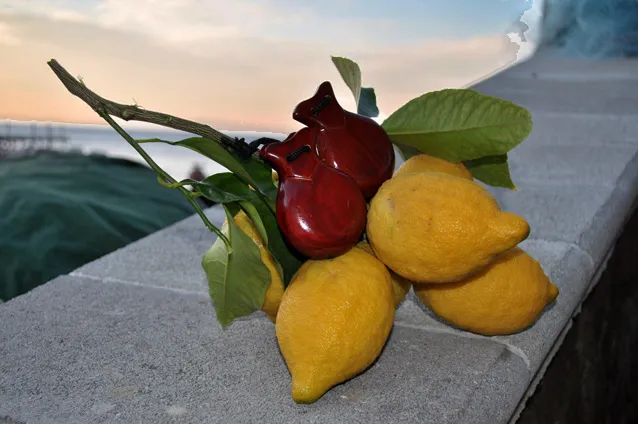 Wooden nacchere (castanets) among the lemons